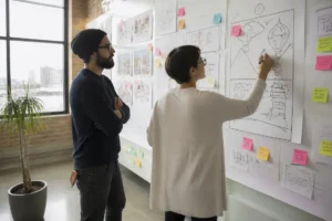 Digital marketing team reviewing wireframes and fun strange websites concepts in a Denver studio