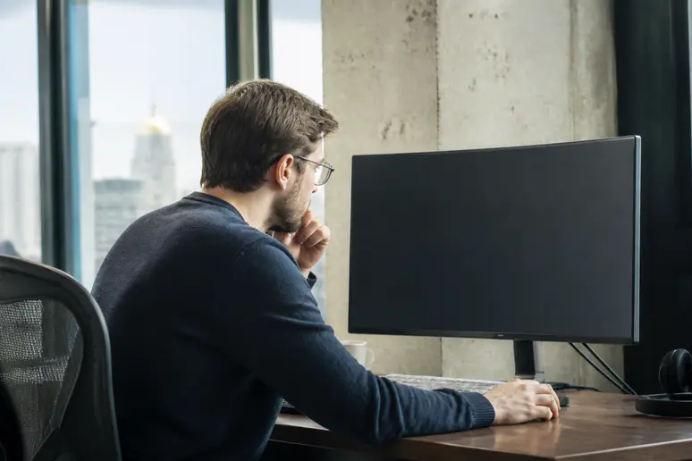Digital strategist analyzing server log files for enterprise SEO architecture assessment