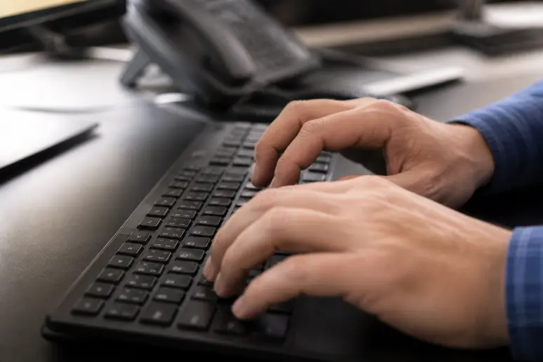 Technician carefully updating DNS records and nameservers during a registrar migration